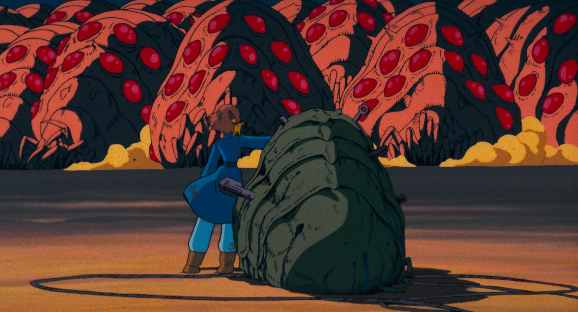 怒り狂う王蟲の群れ 「大海嘯」 と、それを止めようとするナウシカ (C)1984 Studio Ghibli・H